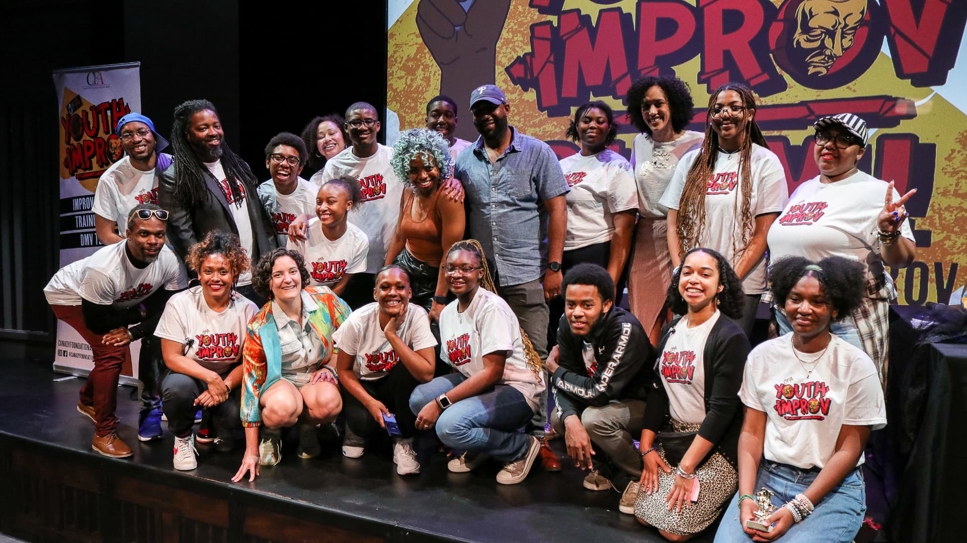 Young performers and mentors on stage at the CFA Youth Improv Slam